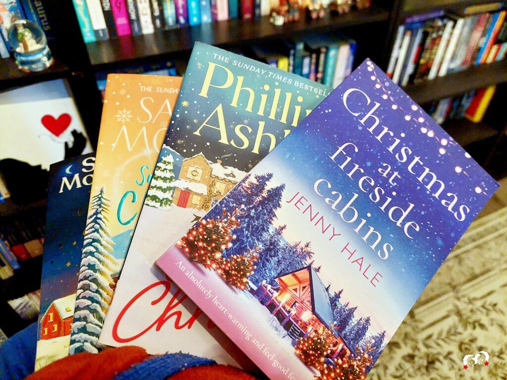 4 kerstboeken in de hand